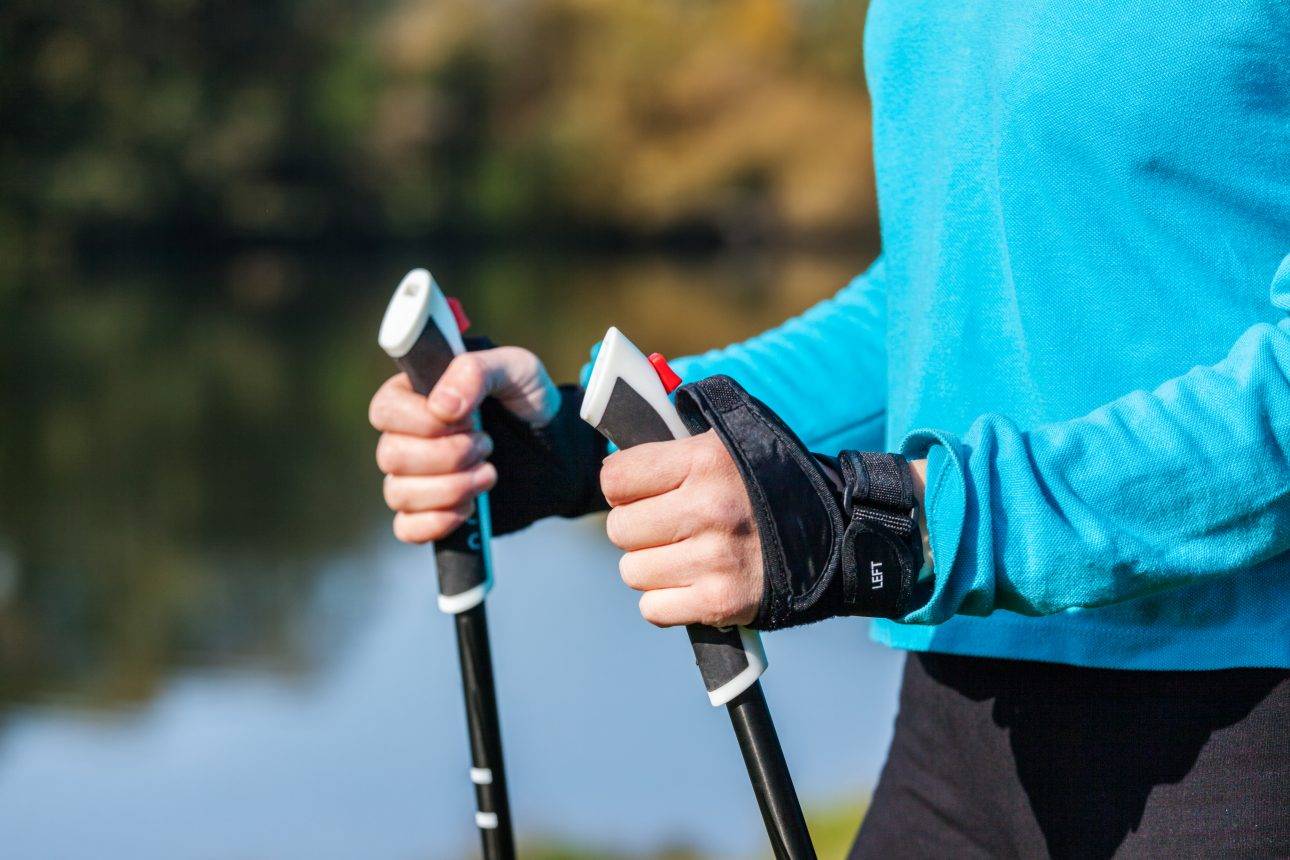 closeup of woman's hand with nordic walking poles